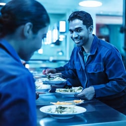 Firefly a blue image showing workers taking a meal break in a cafeteria 44434