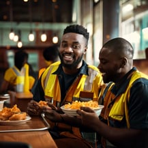 Firefly janitorial workers eating in a cafeteria 25495
