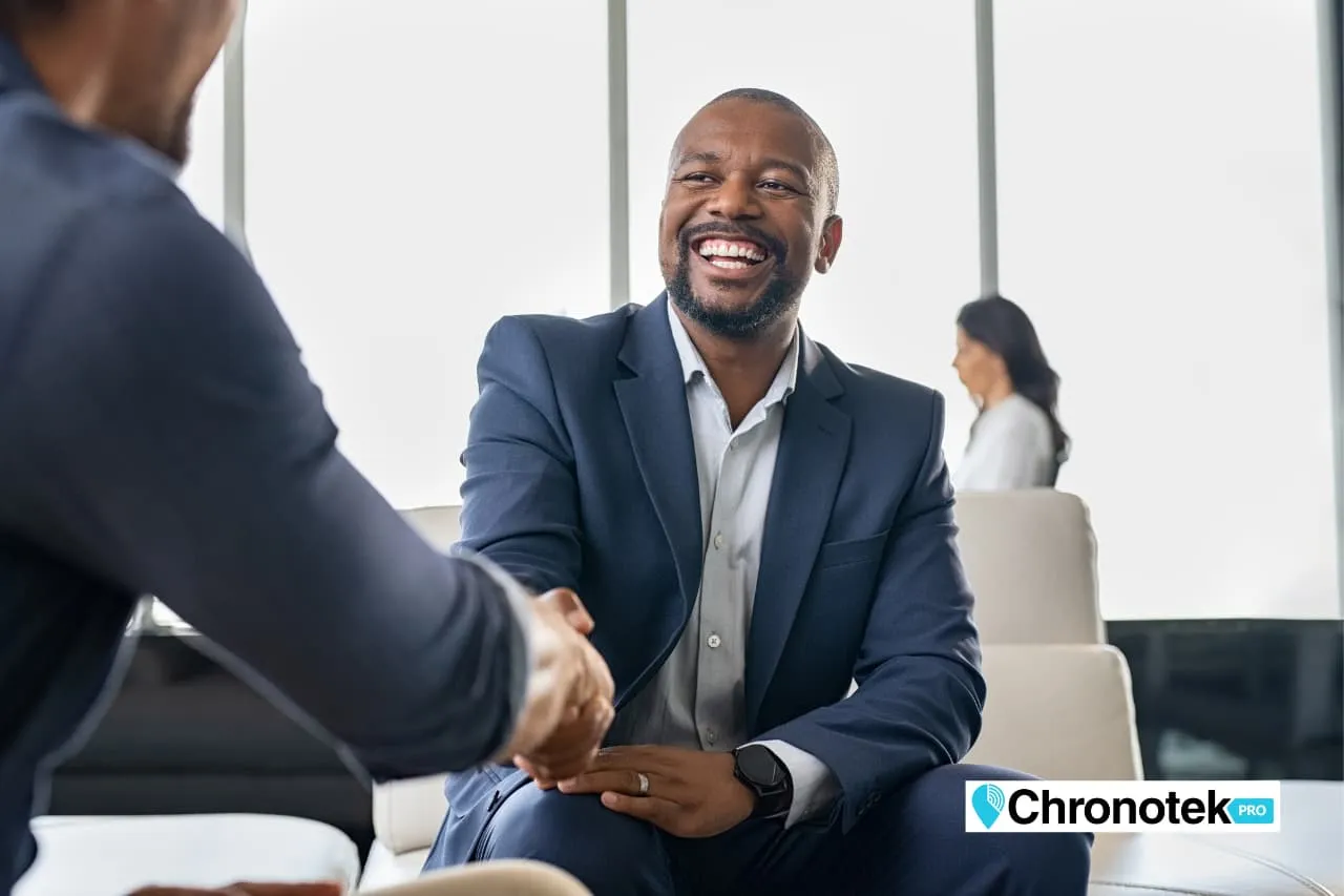 A customer smiling, satisfied with the service they received due to employee time tracking