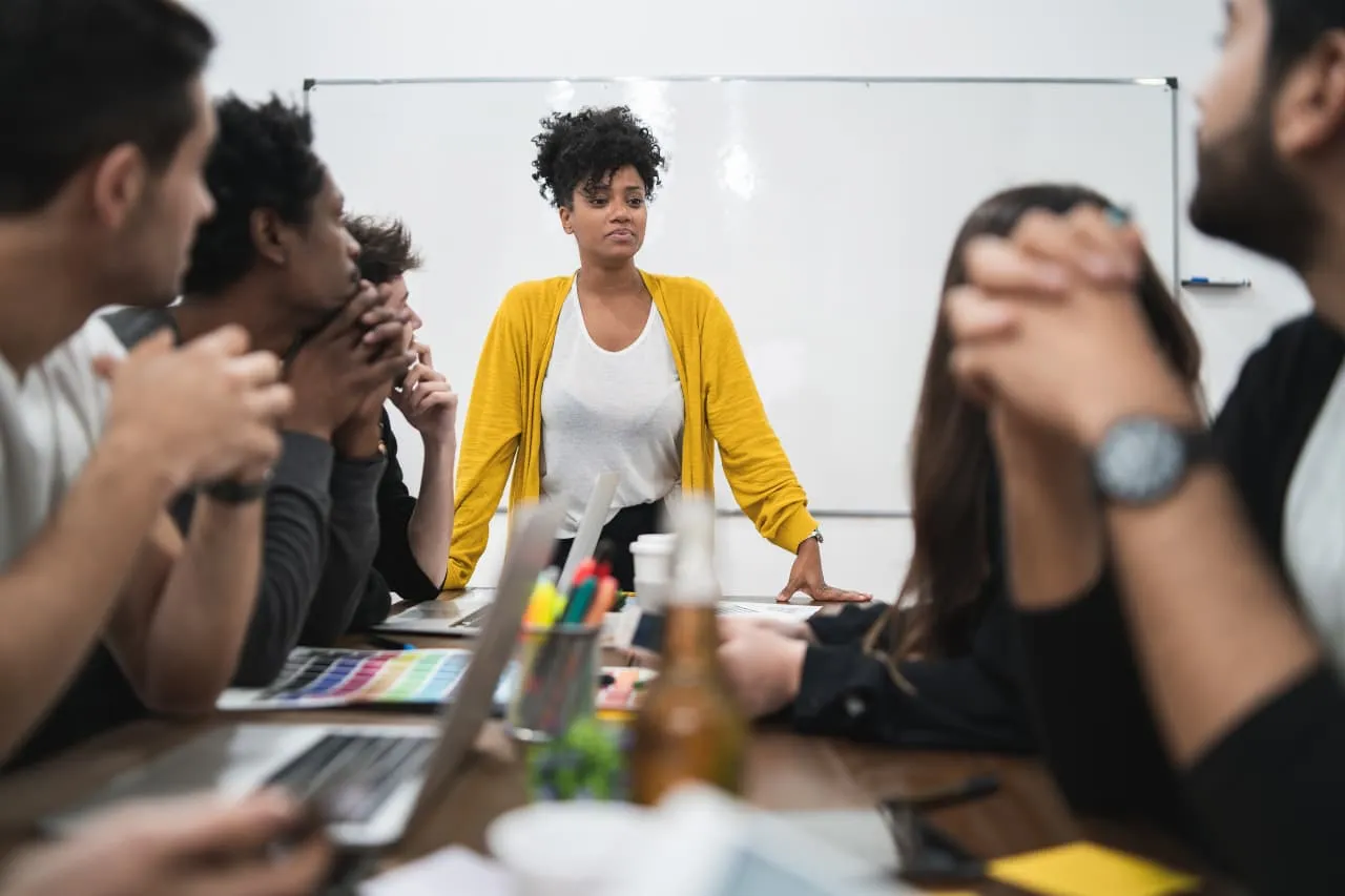 An image showing a group of employees participating in the referral program employee for Management Support