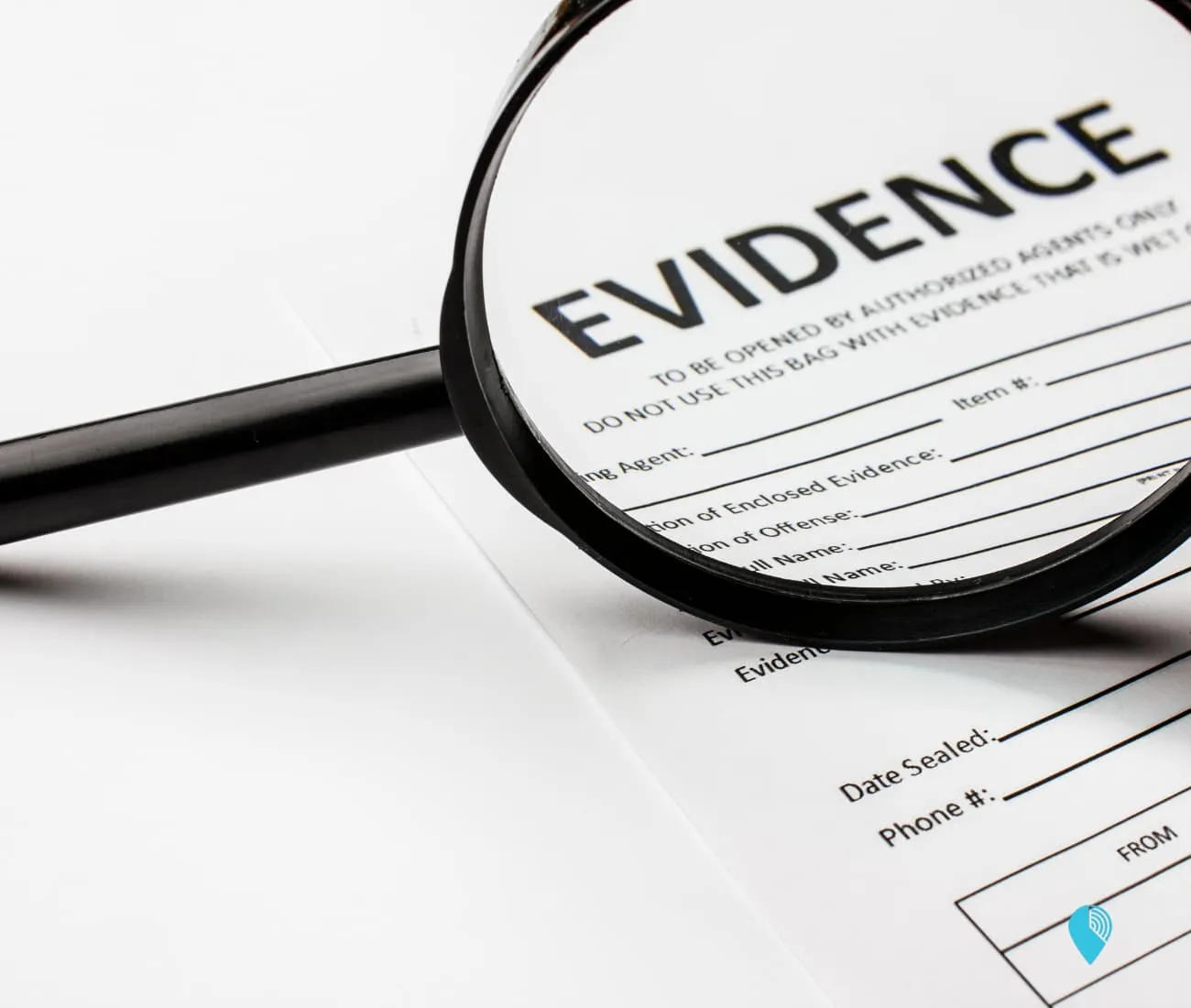 magnifying glass looking at paper document in employee handbood with the word evidence