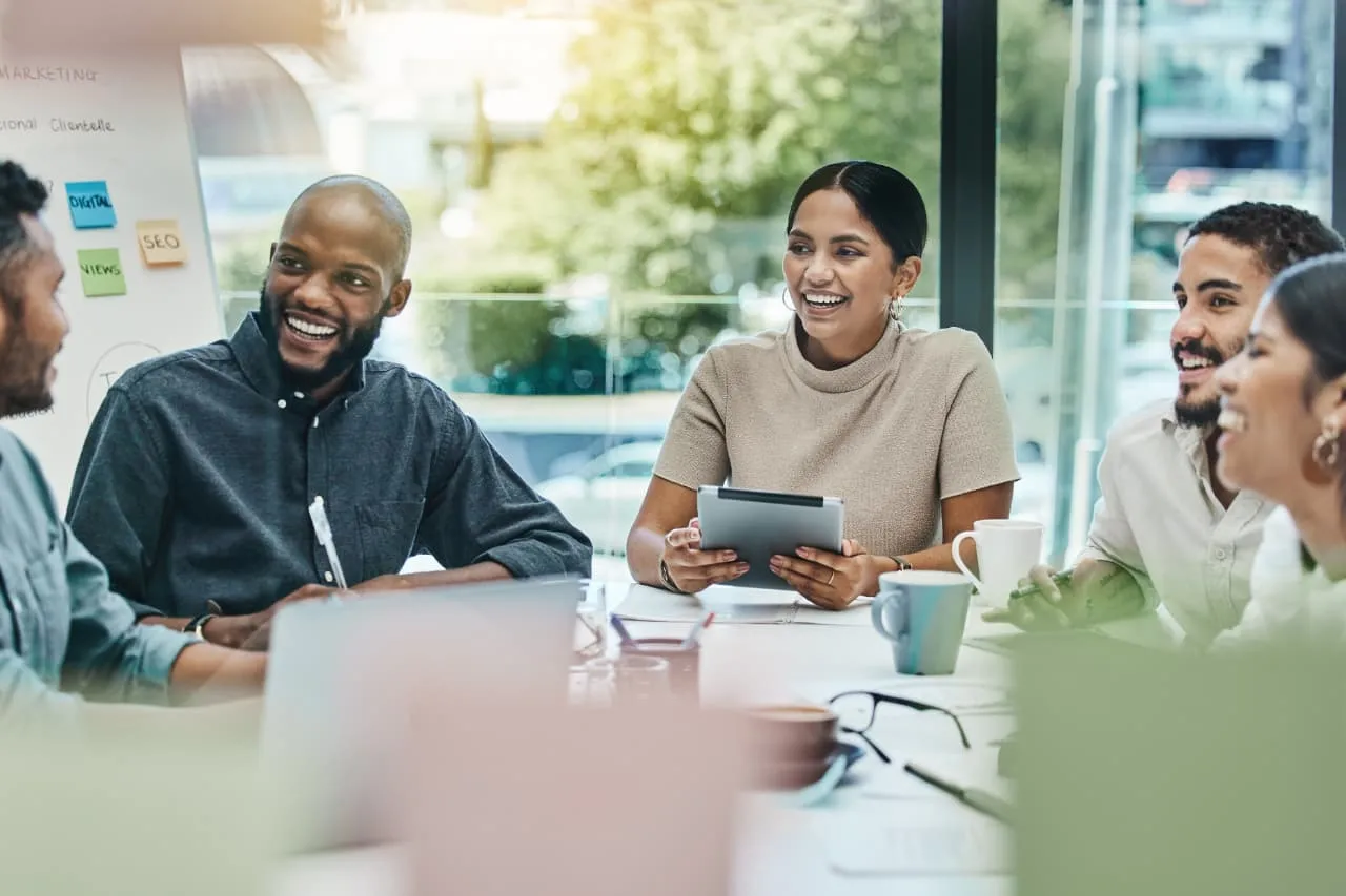 Employees discussing how to promote and integrate employee referral program