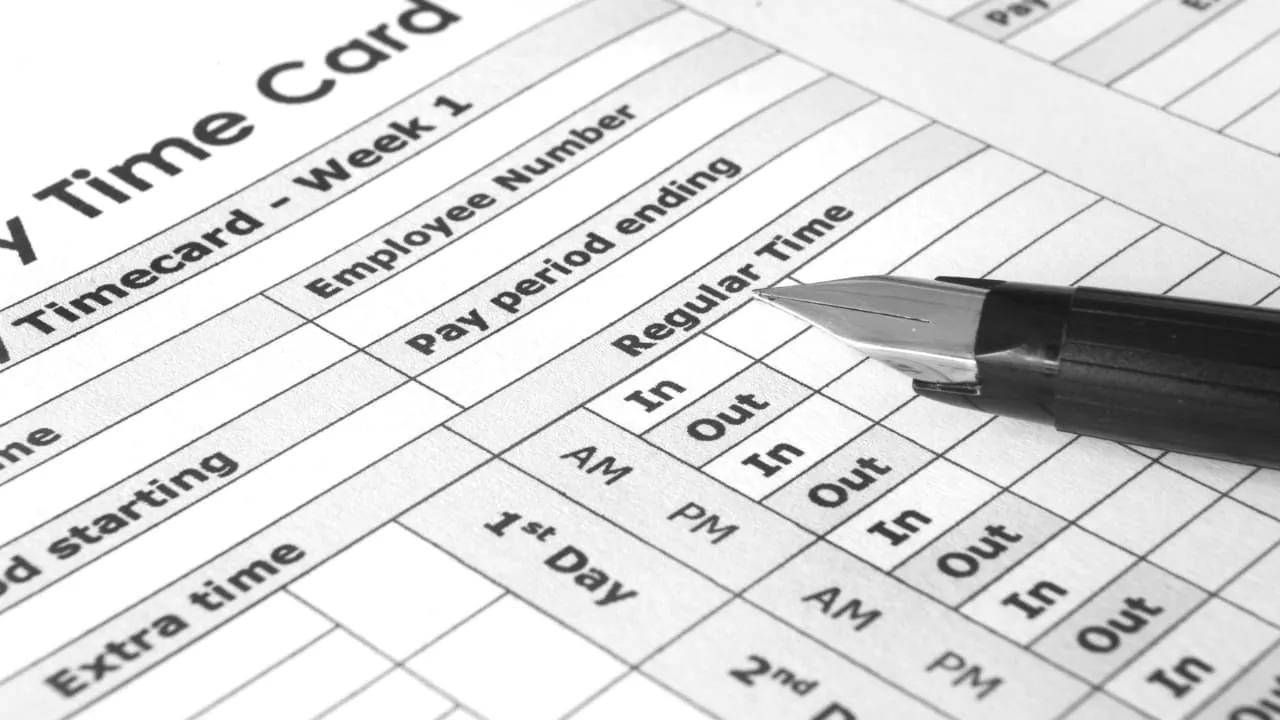 An image showing a timecard with altered hours, representing the consequences of employer changing hours worked unlawfully.