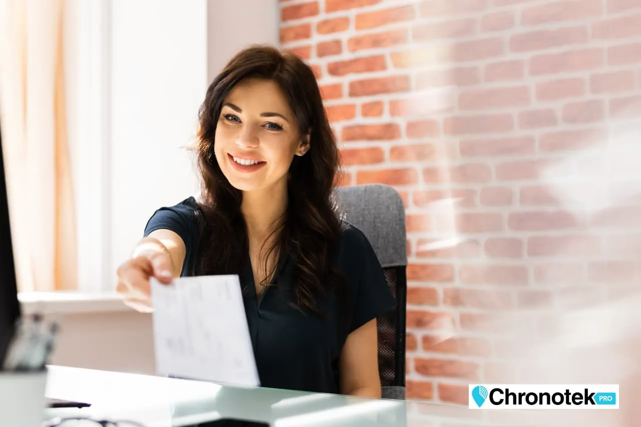 a happy payroll admin who uses a time tracker app to streamline payroll and eliminate costly mistakes