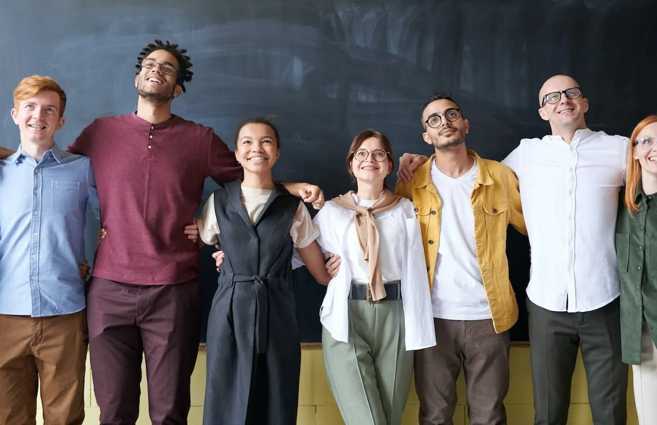 Group of diverse employees working together in a supportive environment